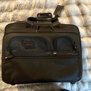 Tumi Black rolling briefcase, perfect for pilots